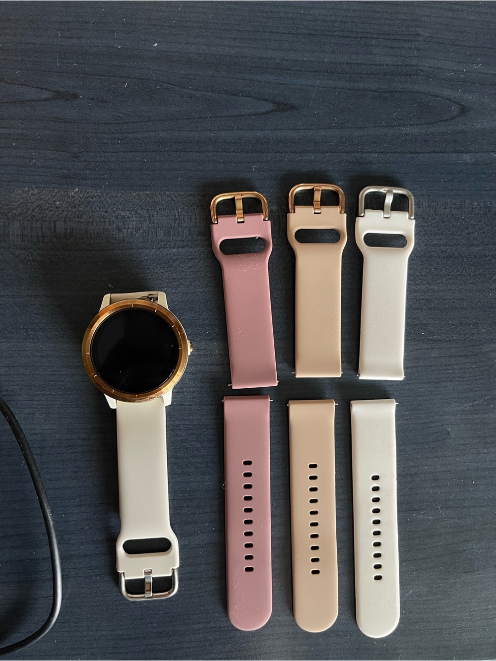 garmin watch with gold bezel and pink, cream, beige bands (vivoactive 3)